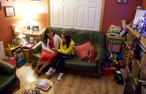 Debbie with daughter on the couch