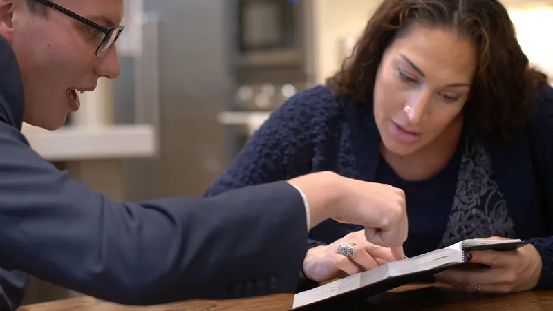 A woman is taught about forgiveness by study of the Book of Mormon through the help of two elder missionaries