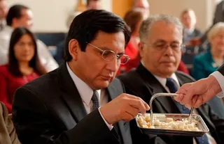 man partaking of the sacrament