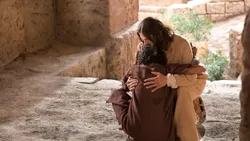 Jesus Christ heals a man and hugs him comforting him after he was healed