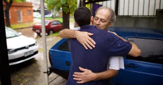 a father and son hug