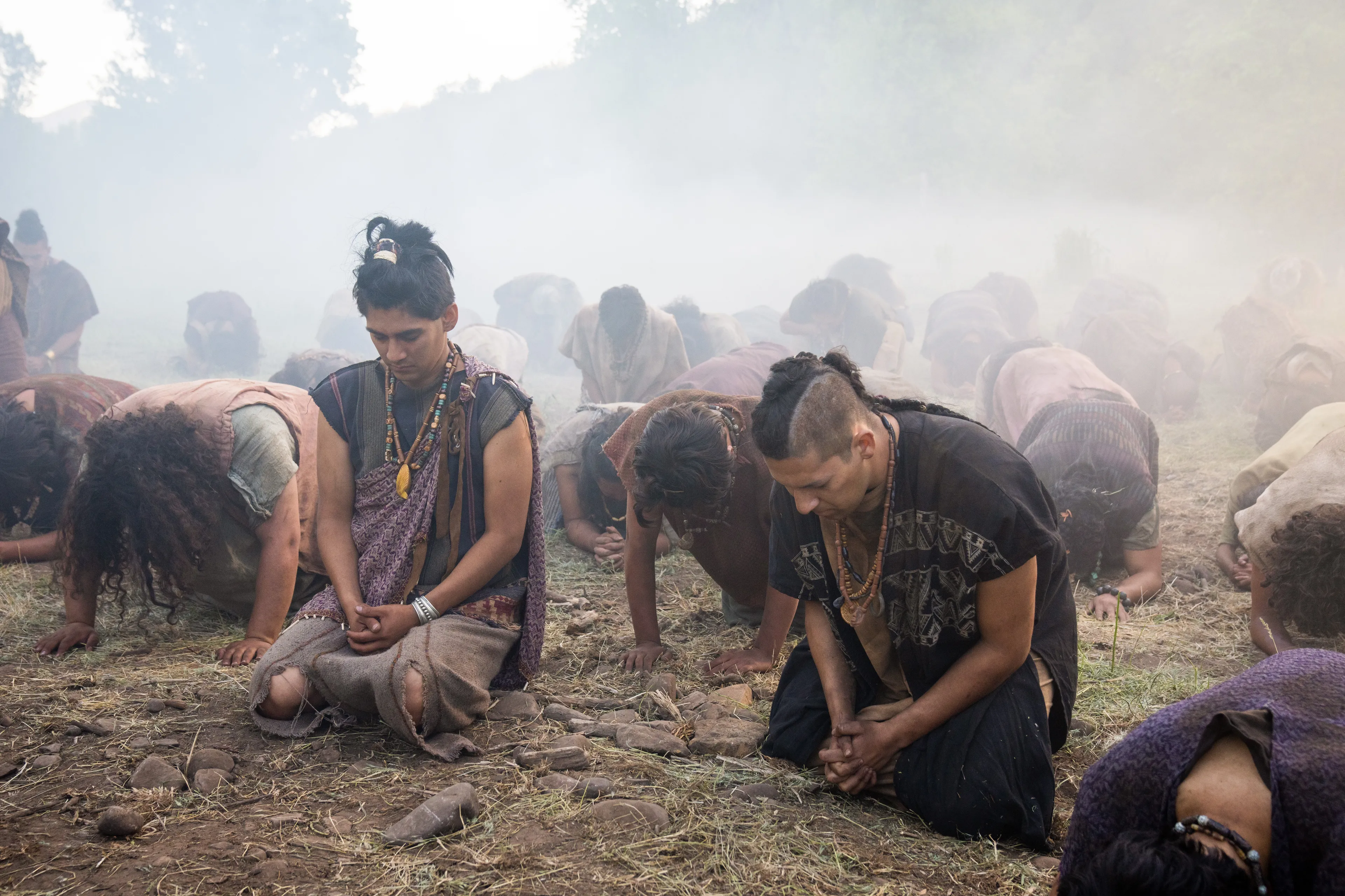 The men of Anti-Nephi-Lehi kneel and pray as the Lamanites attack them.
