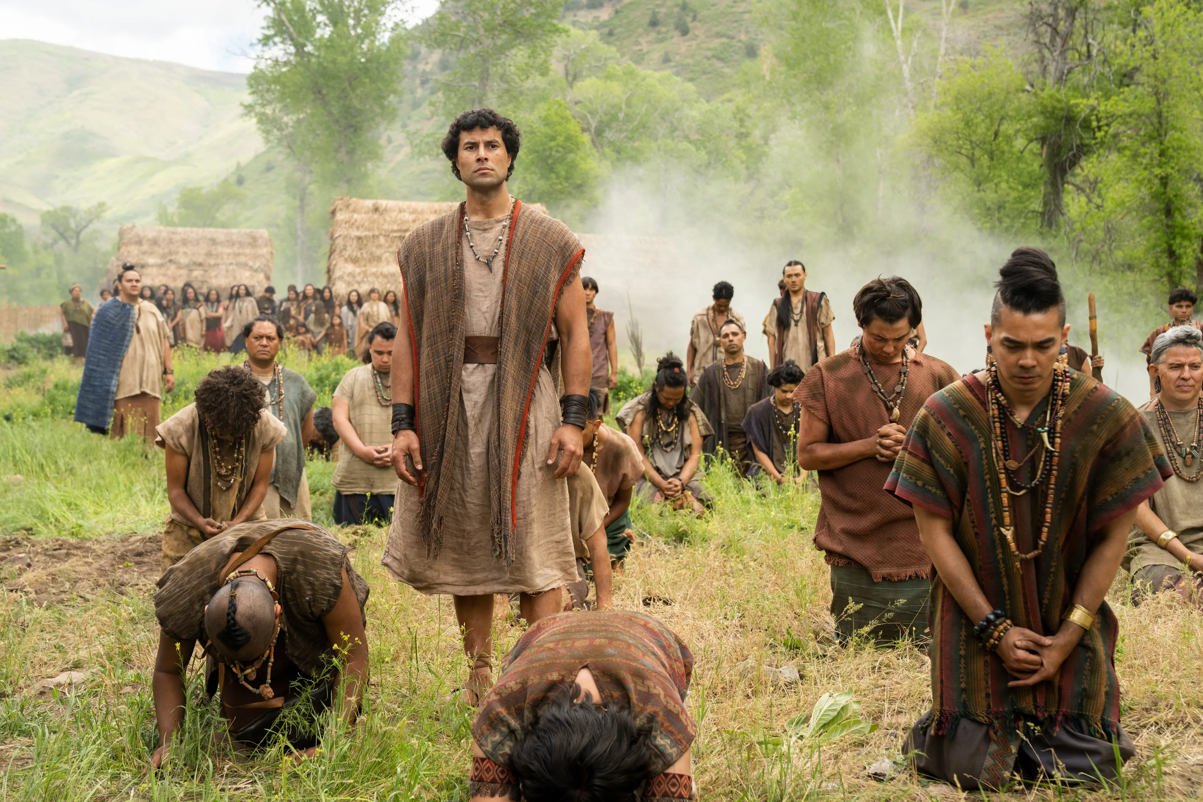 The men of Anti-Nephi-Lehi kneel and pray as the Lamanites attack them.