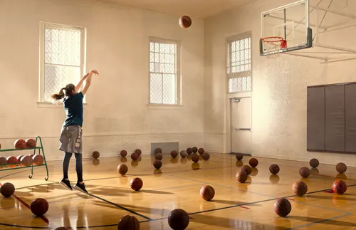 young adult shooting baskets