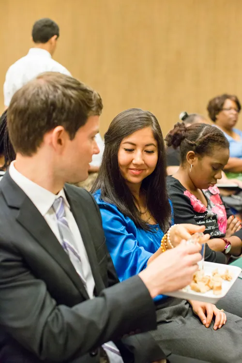 man and woman with tray of bread