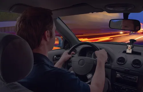 a man driving a car at night