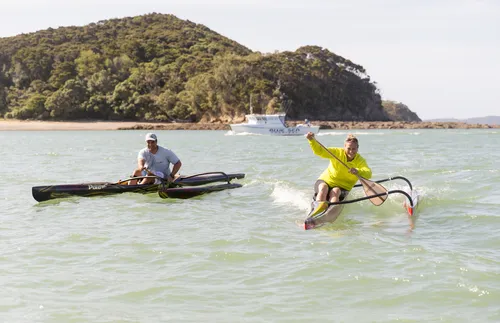 Iona on the water in her outrigger canoe