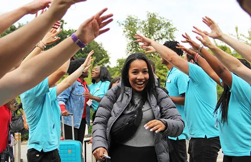 young woman arriving at FSY conference