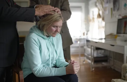 woman receiving a blessing