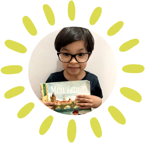 boy holding up copy of Friend magazine