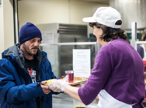 woman serving man food