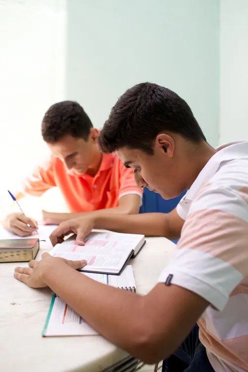 young men studying the scriptures