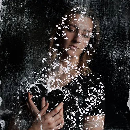 woman holding the image of a heart