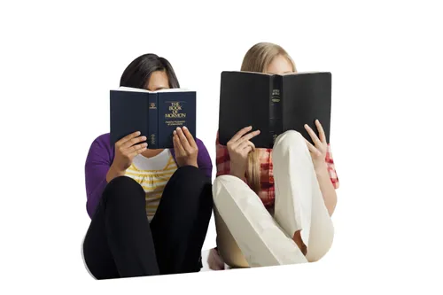 two young women reading scriptures