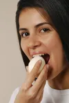 woman eating egg
