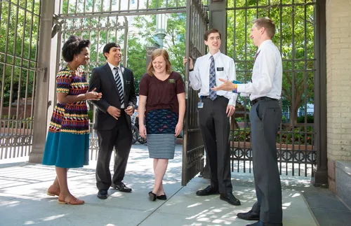 group of missionaries talking together
