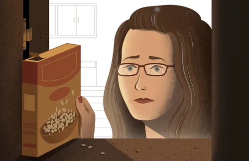 woman pulling out box of rice from cupboard