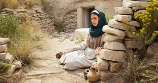 Mary weeps outside the tomb