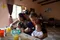 Women and children eating at table in Cochabamba Bolivia