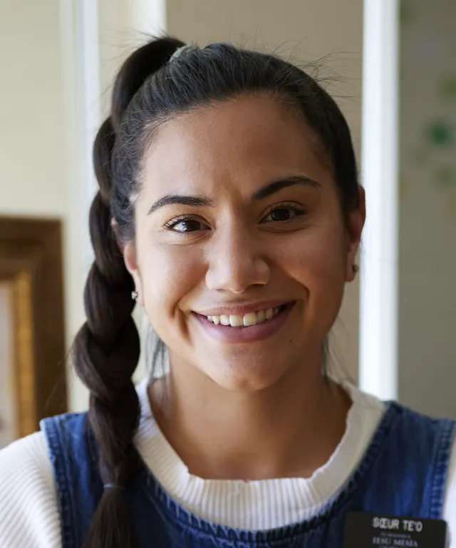 Various sister missionaries model appropriate dress and attire. They are wearing approved shirts. The missionaries smile.