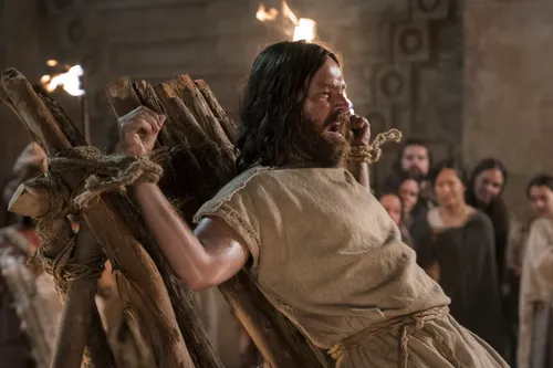 Abinadi is martyred. Guards and members of the court stand by and watch.