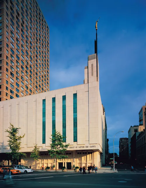The front entrance of the Manhattan New York Temple at sunset, viewed from across the street.