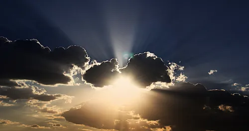 Sun streams through clouds