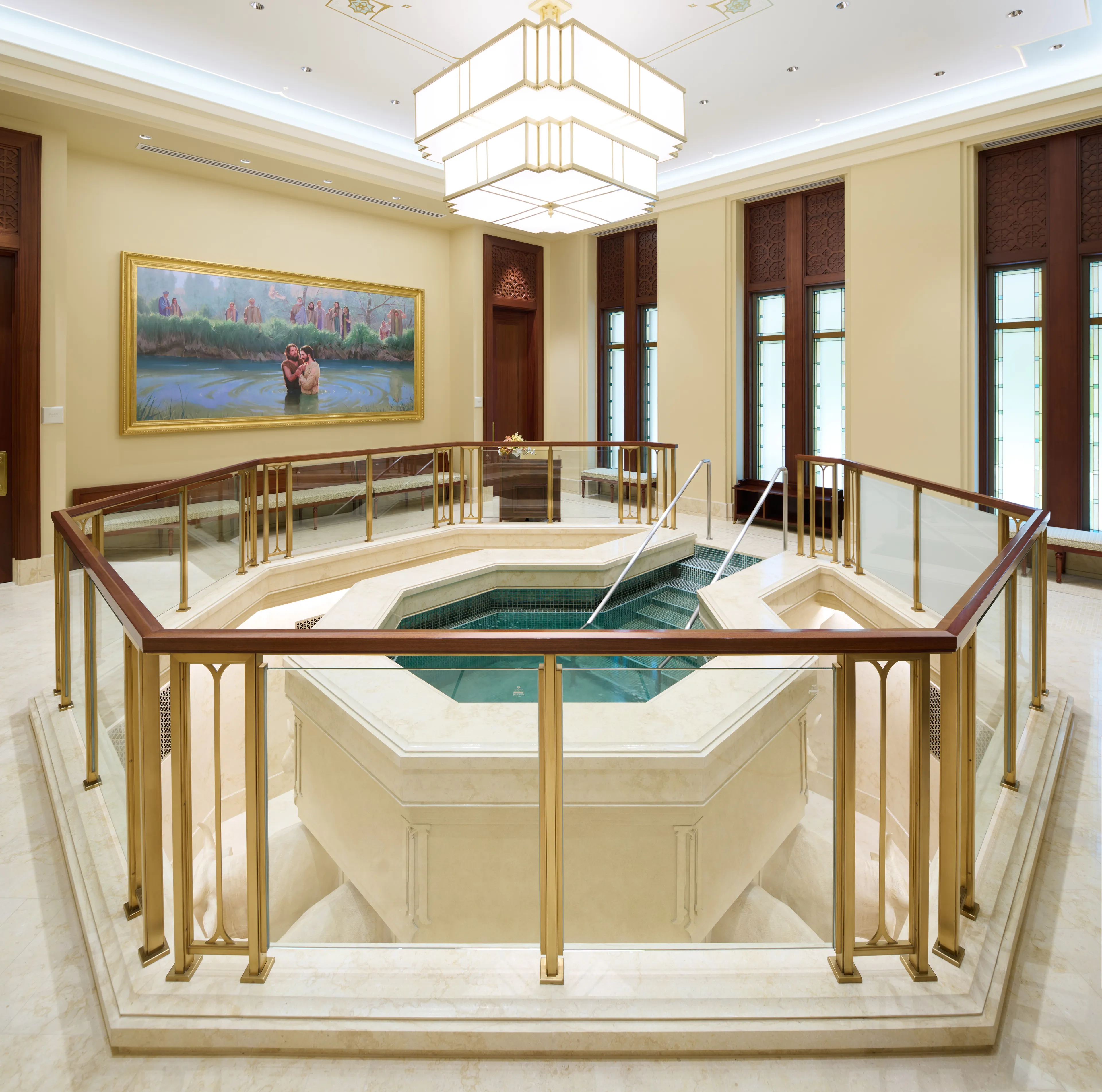 Interior image of the Bangkok Thailand Temple showing the baptistry. The image features the font with art to one side.