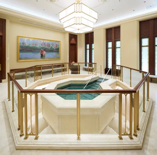 Interior image of the Bangkok Thailand Temple showing the baptistry. The image features the font with art to one side.