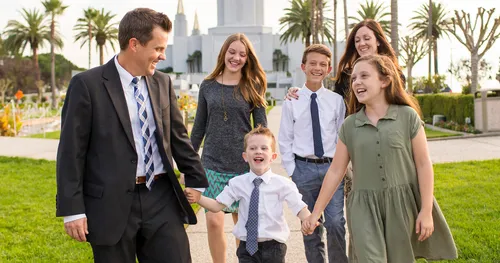 family walking on temple grounds