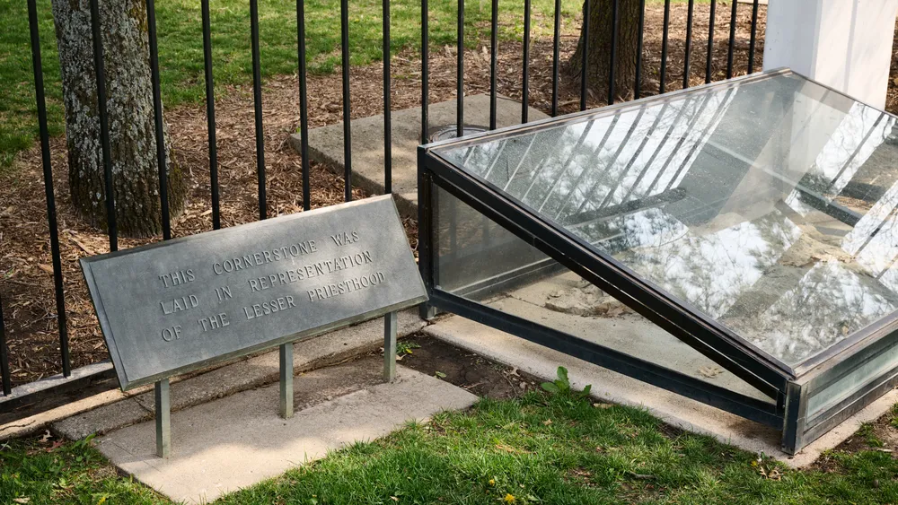 Image of the cornerstone at the Far West temple site, where the Twelve began their mission to Great Britain. The cornerstone is covered in a glass case.