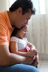father and child praying