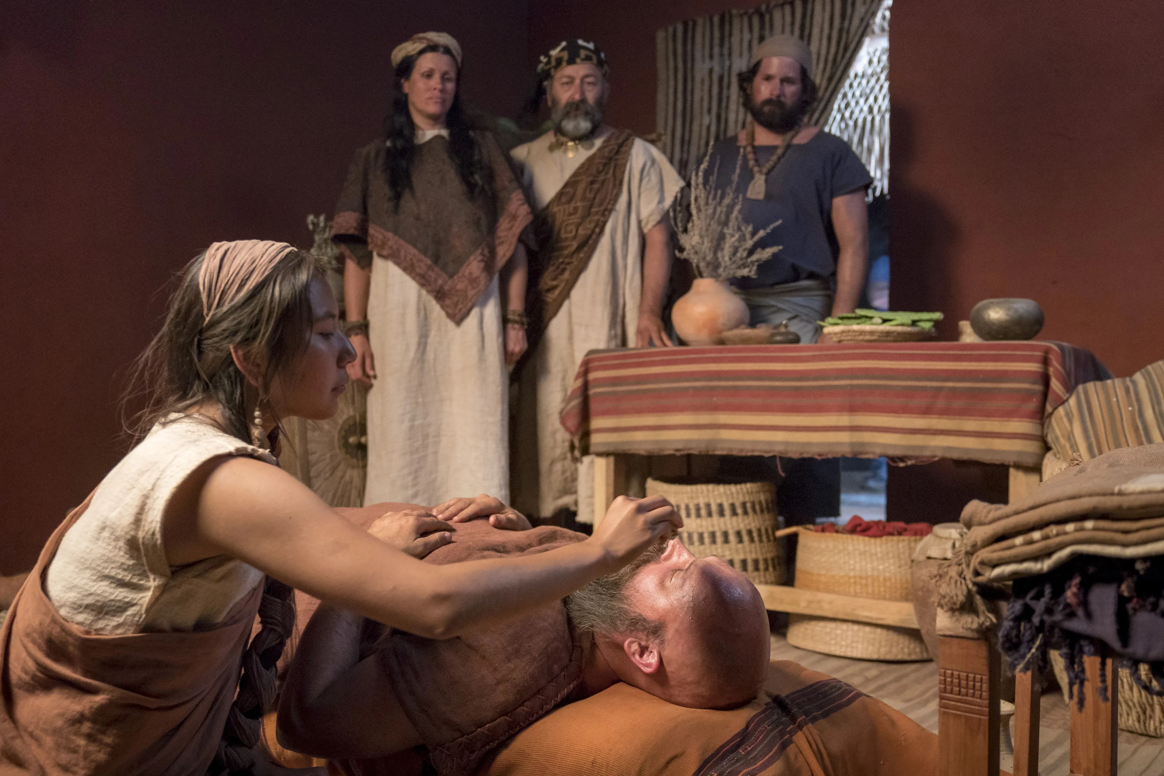 Sherem lays in bed after being struck down as a sign from God.