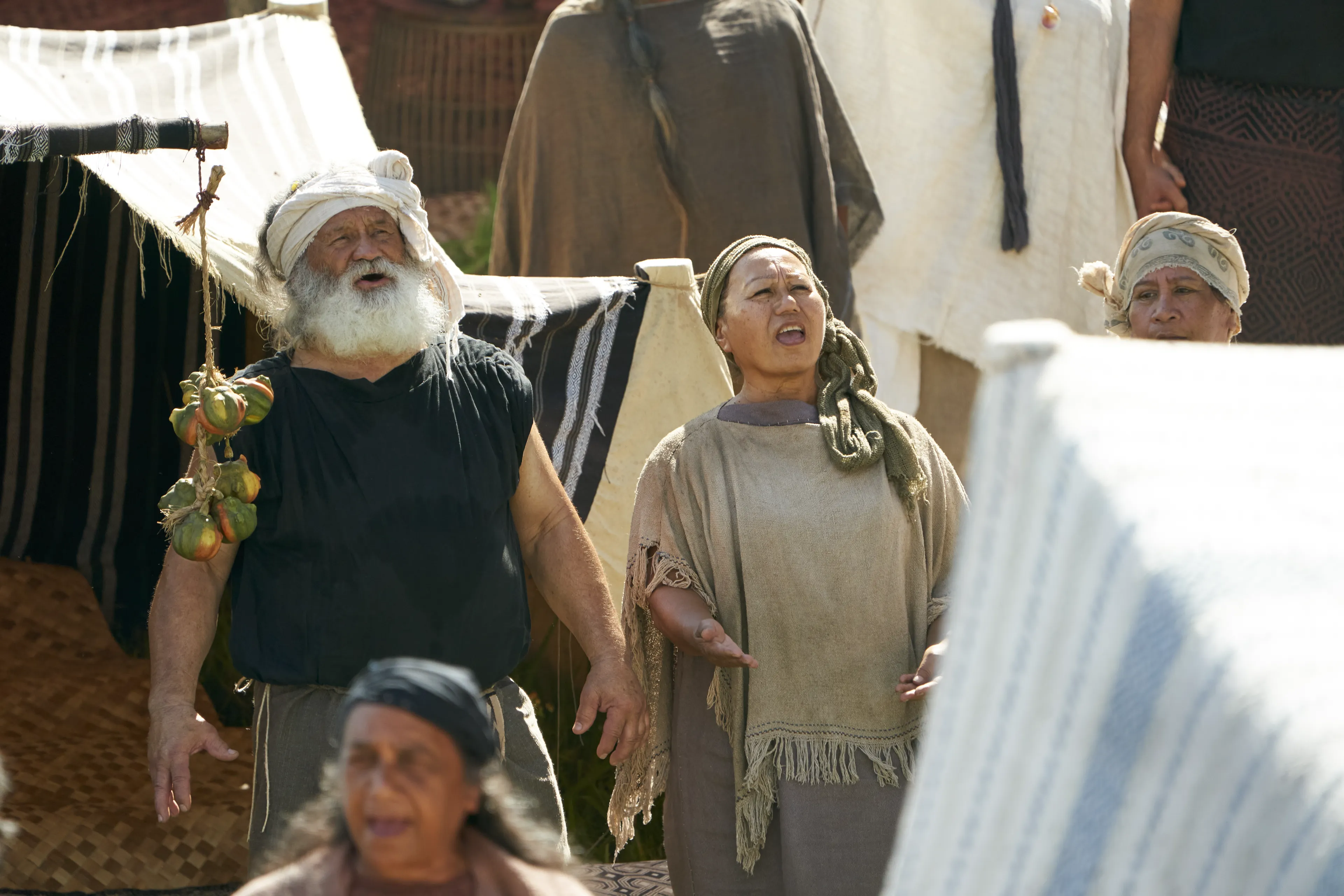 Men and women gather to listen to King Benjamin in the Land of Zarahemla.
