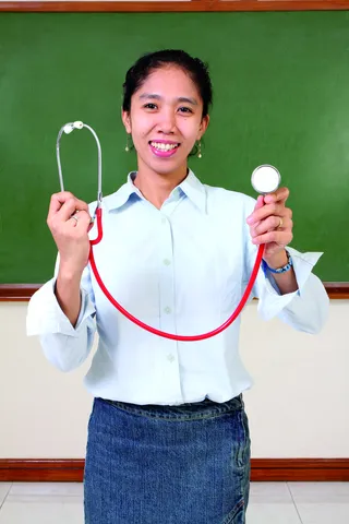 teacher holding a stethoscope