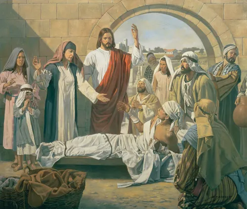Jesus Christ in white and red robes, raising His arm to bring a young man back to life while his family and friends watch.
