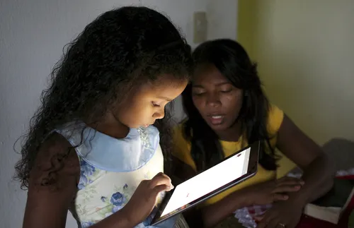 girl looking at tablet