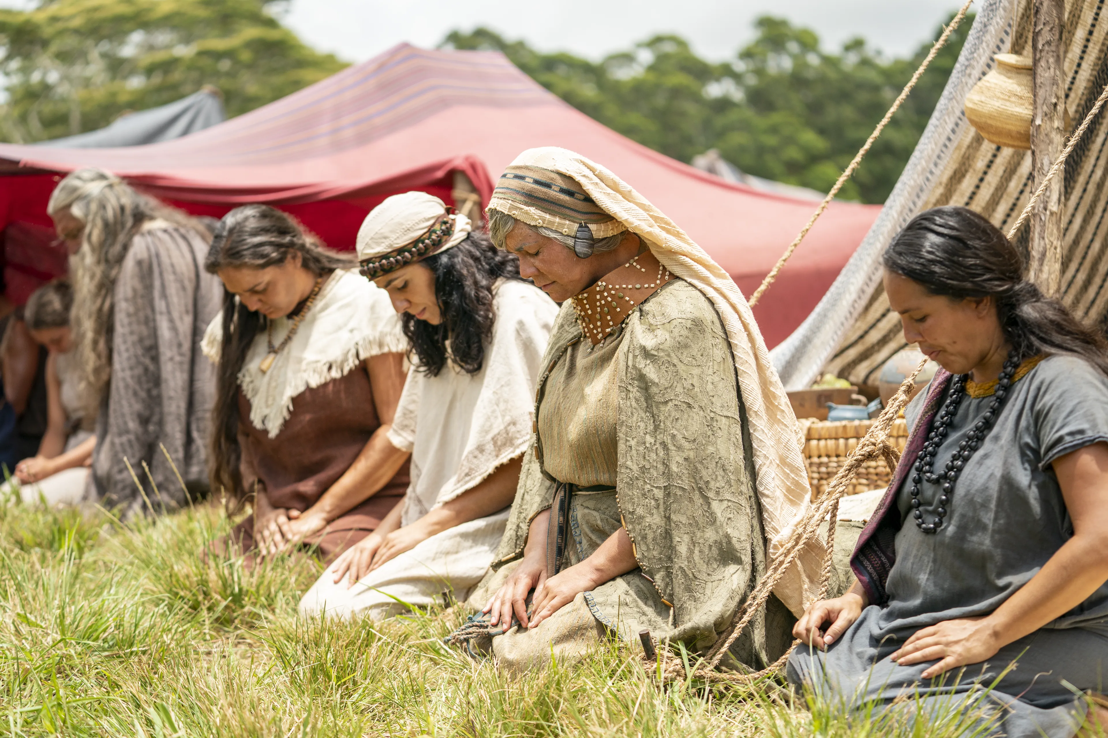 Men and women gather to listen to King Benjamin in the Land of Zarahemla.