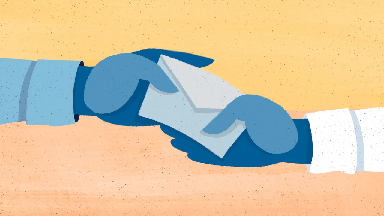 A man hands another man an envelope