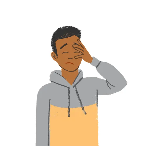 young man looking hopeless, with hand on his face