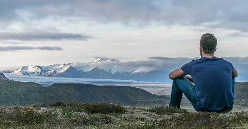 young man looking at landscape