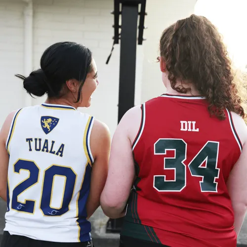 young women in basketball jerseys
