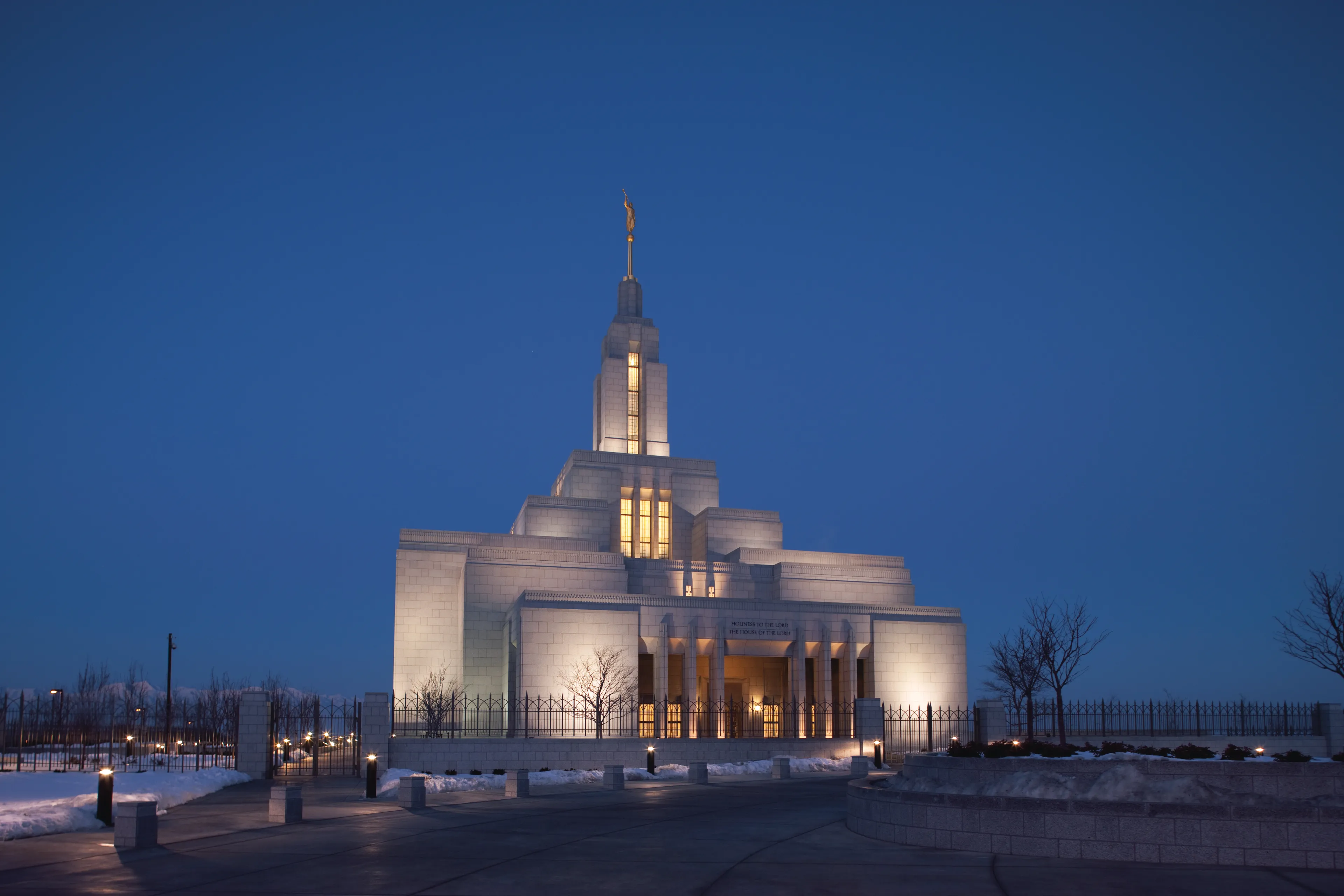 An exterior view of the Draper Utah Temple at night.