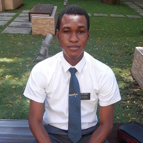 missionary sitting on a bench