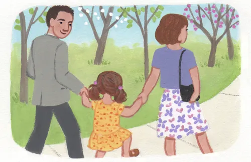 girl holding mom and dad’s hand outside