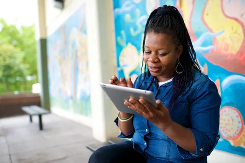 A woman using a tablet computer