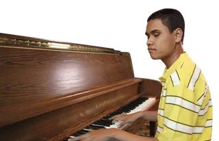 young man at piano