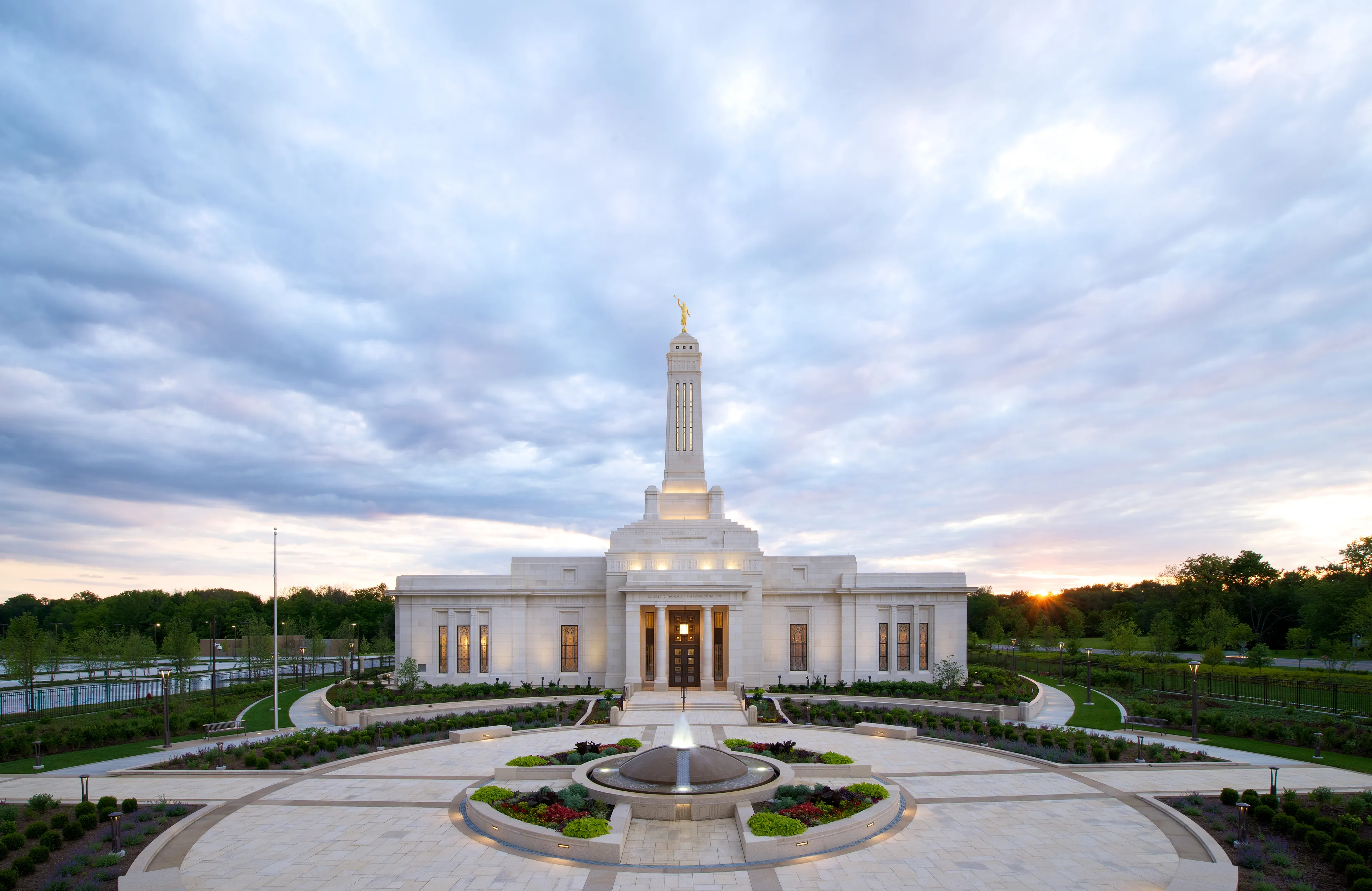 The Indianapolis Indiana Temple with a sunset in the background.
