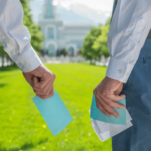 young men with slips of paper in front of the temple
