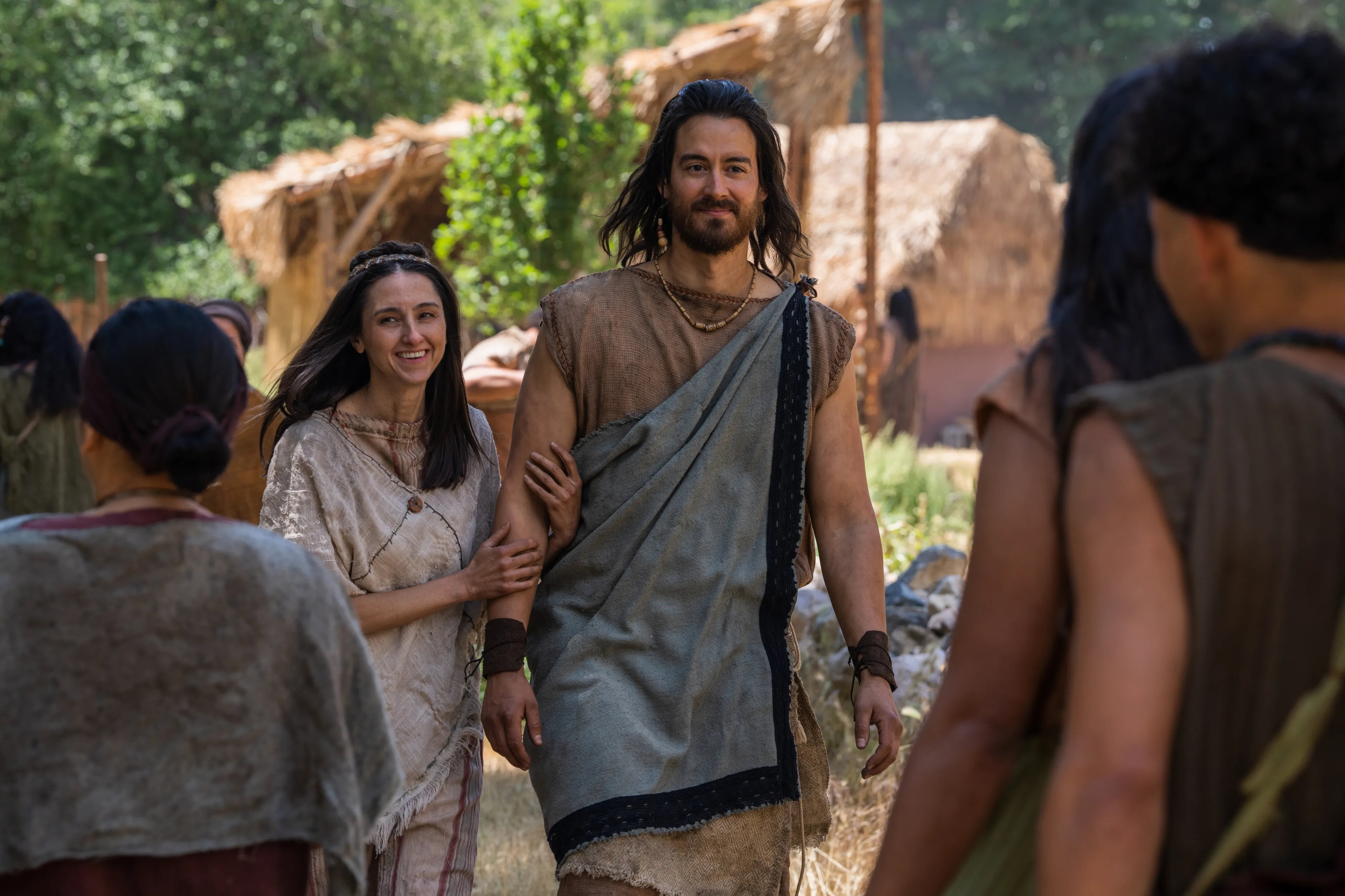 Alma appears to be happy as he walks through the City of Helam with his wife.